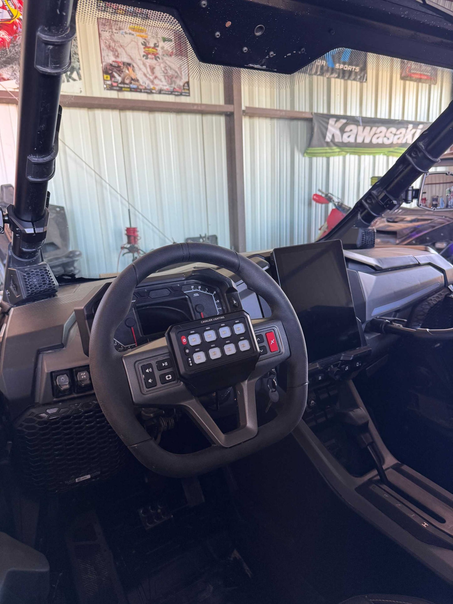 Cavalier Lighting Polaris RZR switch panel mounted on steering wheel with 8 gang switches for easy 12v accessory control
