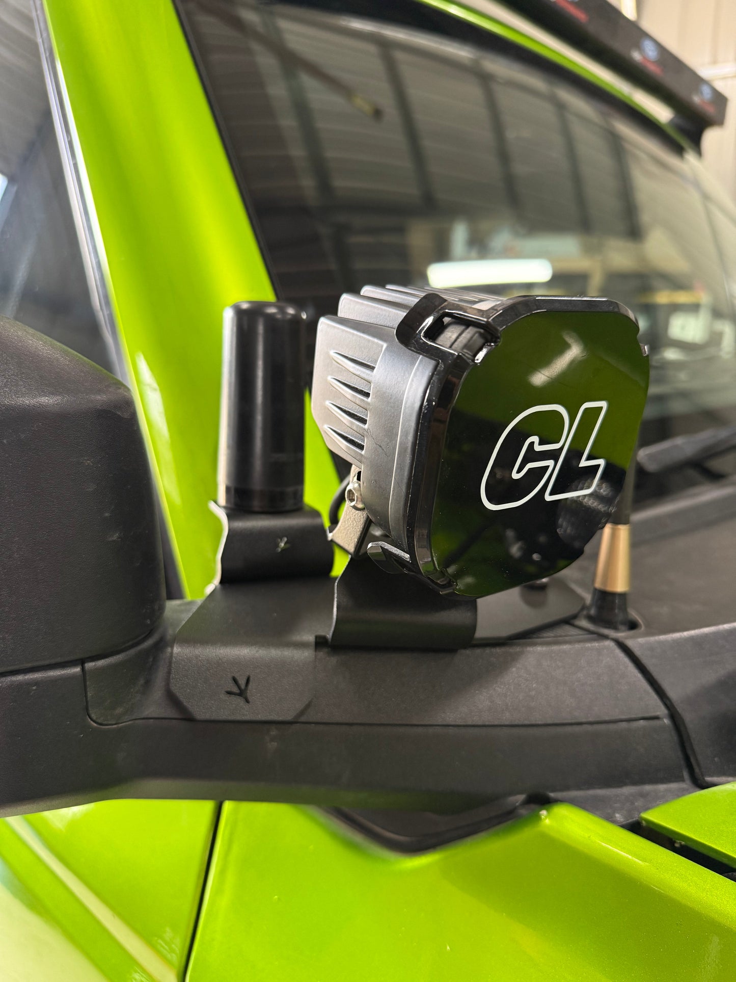 6th Gen Ford Bronco elevated stainless steel ditch light mount reducing hood reflection