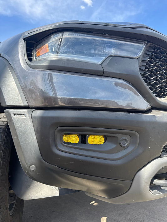 2019+ Dodge Ram fog light kit with T2 LED pods and wiring harness installed on truck